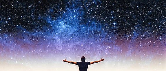 Silhouette of man and stars sky. Elements of this image furnished by NASA